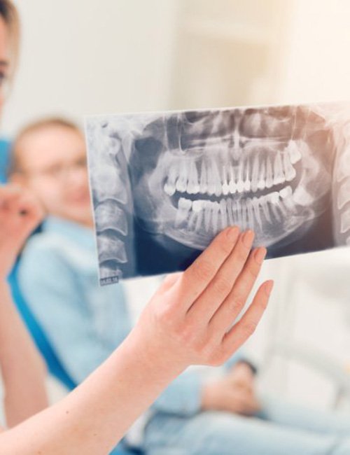 Dentist showing a patient their X-ray